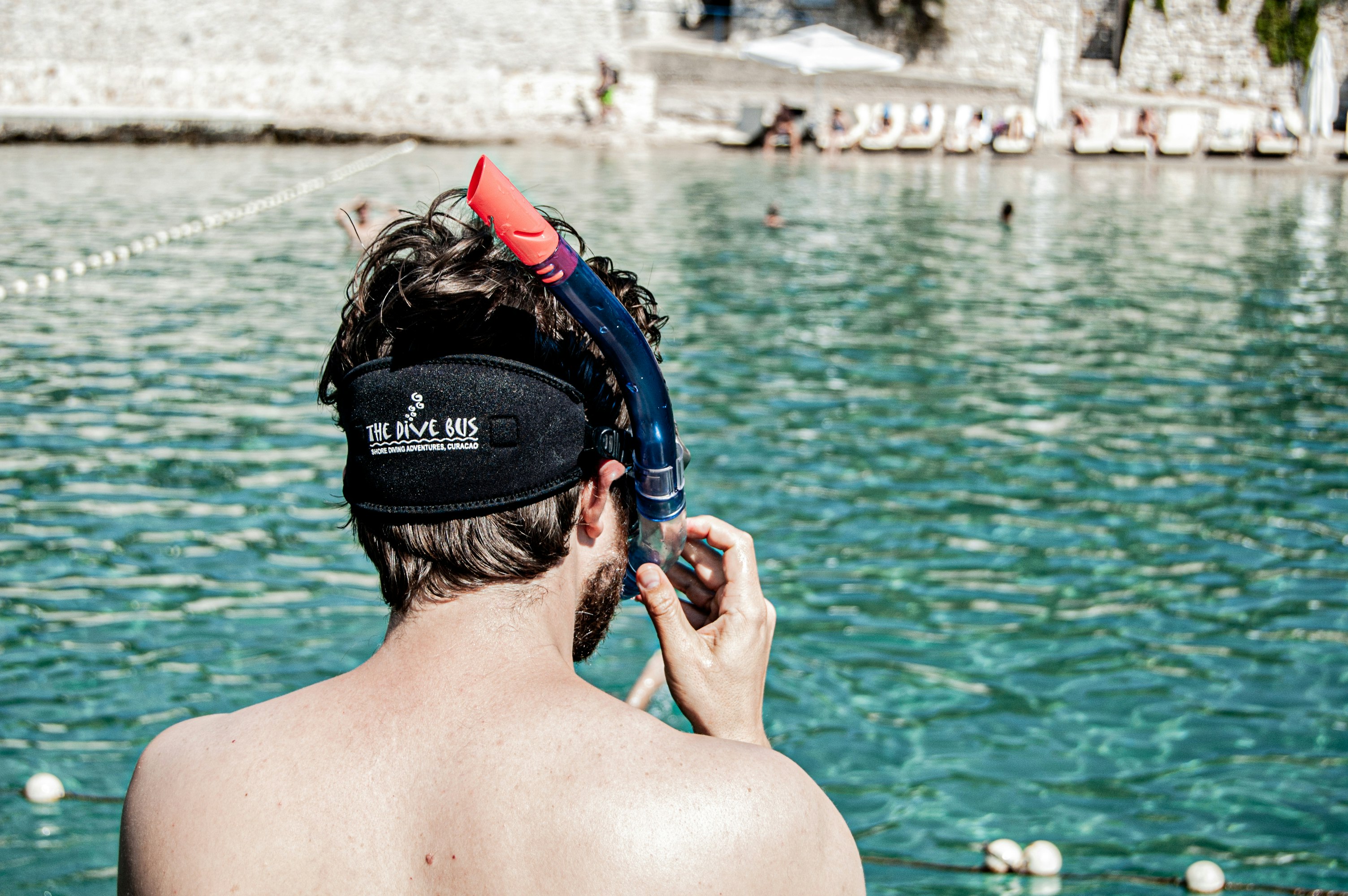 woman in black swimming goggles and black goggles